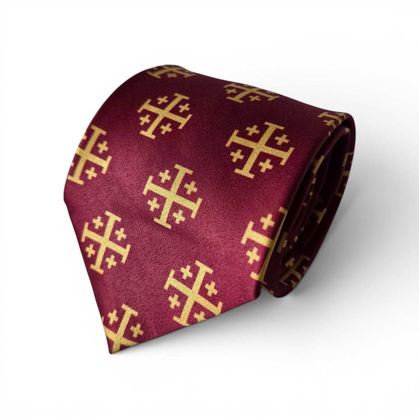Gold Jerusalem Cross necktie in maroon with repeating gold crusader cross pattern, rolled product shot on white background