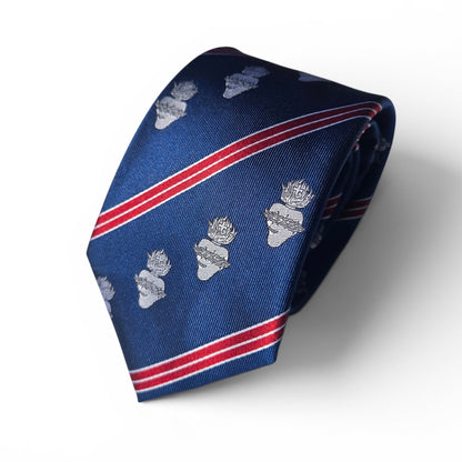 A navy blue silk necktie with diagonal red and white stripes and repeating sacred heart motifs, displayed on a clean white background rolled.