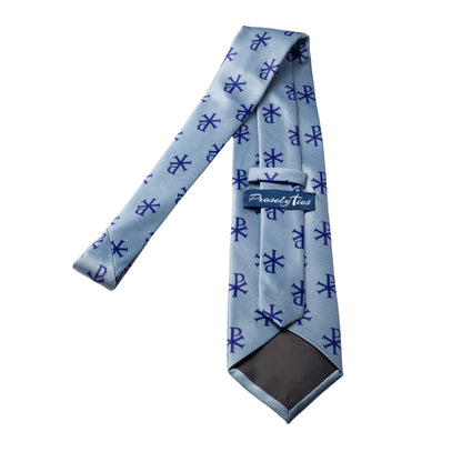 Blue Chi-Rho necktie showing ProselyTies brand label and back detail, full length flat lay on white background