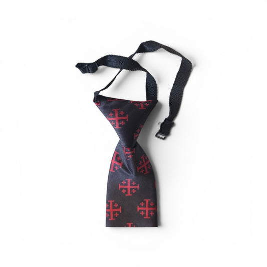 Boys Jerusalem Cross pretied necktie in black with repeating red crusader cross pattern, showing adjustable neck strap and buckle closure on white background