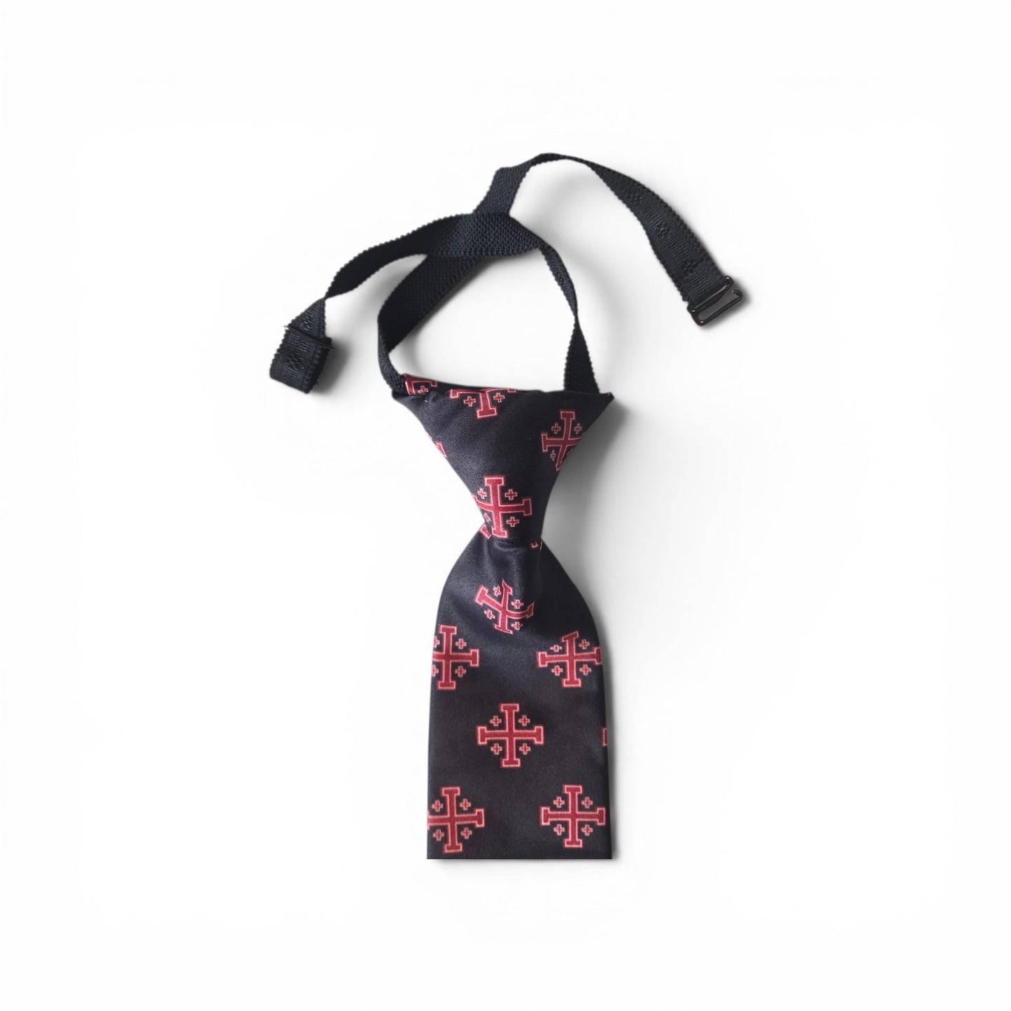 Boys Jerusalem Cross pretied necktie in black with repeating red Jerusalem Cross pattern, showing adjustable neck strap and buckle closure on white background