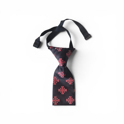 Boys Jerusalem Cross pretied necktie in black with repeating red Jerusalem Cross pattern, showing adjustable neck strap and buckle closure on white background