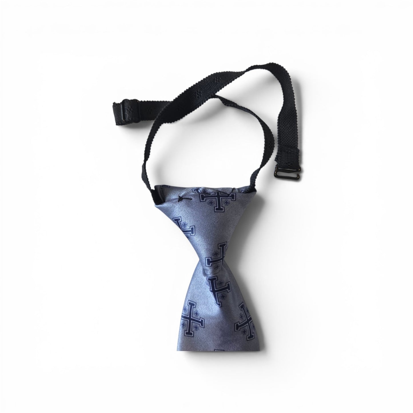 Boys Jerusalem Cross pretied necktie in silver blue with repeating navy and white Jerusalem Cross pattern, showing adjustable neck strap and buckle closure on white background