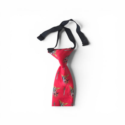 Boys St. Michael pretied necktie in red with repeating Archangel Michael and sword pattern, showing adjustable neck strap and buckle closure on white background