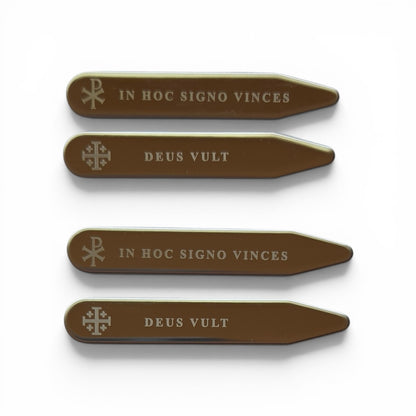 Set of four silver engraved collar stays featuring Chi-Rho with In Hoc Signo Vinces and Jerusalem Cross with Deus Vult inscriptions, flat lay on white background
