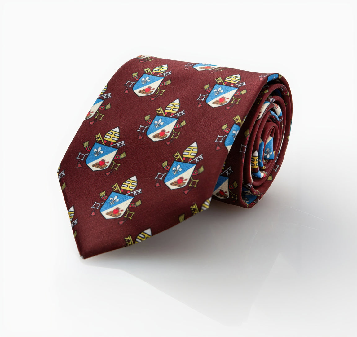 Pope Leo XIV maroon necktie with repeating papal coat of arms pattern, rolled product shot on black background