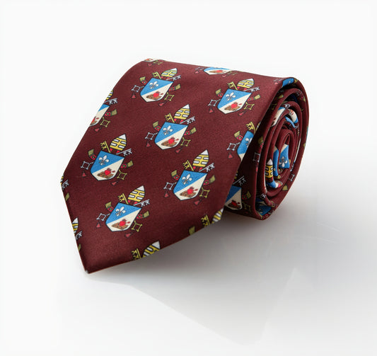 Pope Leo XIV maroon necktie with repeating papal coat of arms pattern, rolled product shot on black background