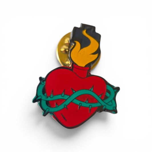 Sacred Heart lapel pin with red enamel heart, green crown of thorns, and gold flame, product shot on white background