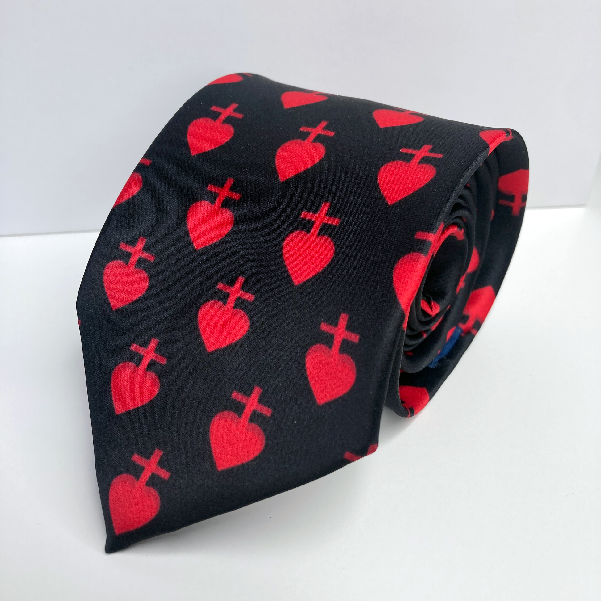 Proselyties Vendee Sacred Heart Catholic necktie rolled up view.