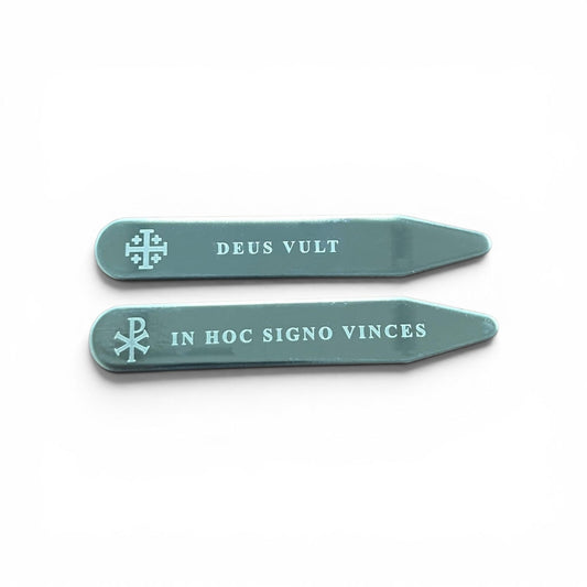 Set of two silver engraved collar stays featuring Chi-Rho with In Hoc Signo Vinces and Jerusalem Cross with Deus Vult inscriptions, flat lay on white background